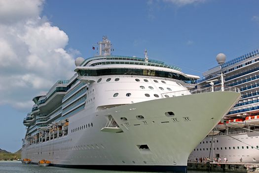 Two Cruise ships docked alongside each other in port