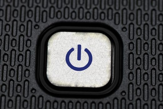 Macro shot of a power button on a laptop