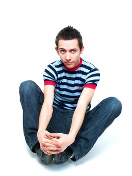 Happy teenager posing on a white background