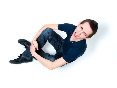 Happy young man posing on a white background