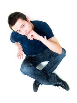 Happy young man posing on a white background