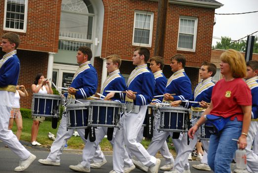 A group of band men playing at a local parade