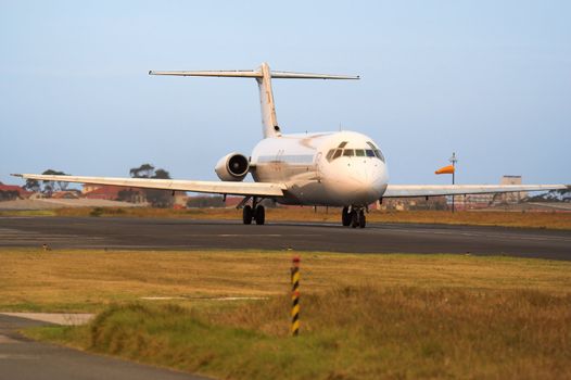 A passenger jetliner on the runway before take off