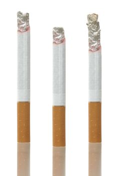 Differently burned cigarettes on white