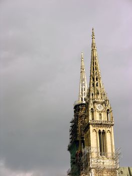Church towers renovating with cloudy sky