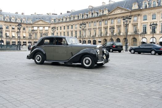 Classic car at the Place Vendome in Paris