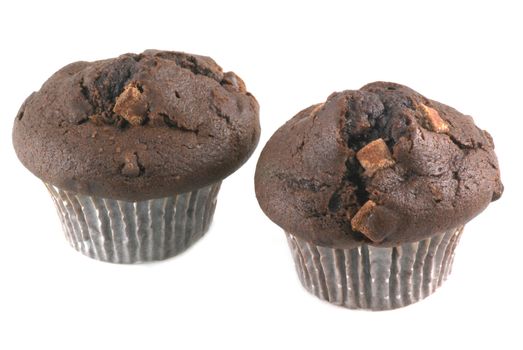 Two chocolate muffins isolated on white.