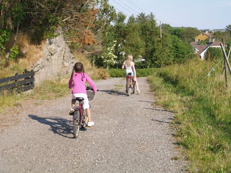 two kids biking together