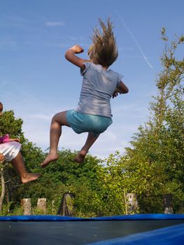 kids jumping on trampoline