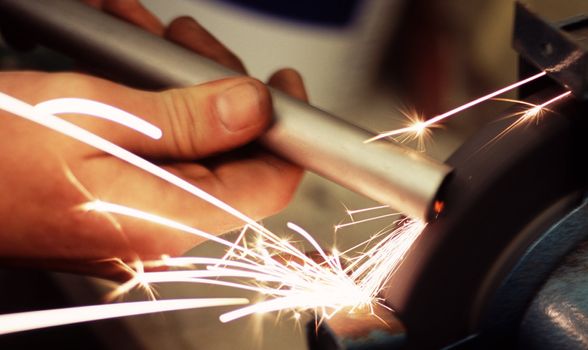 sparks flying from a grinding wheel