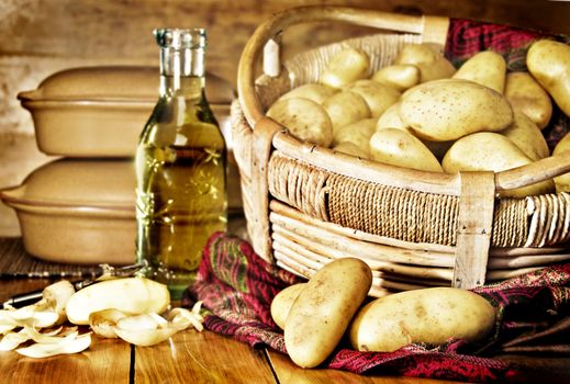 Still life of potatoes in a basket with olive oil