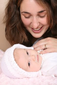 Beautiful mother and two month old baby girl