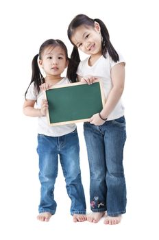 Happy smiling Asian girls holding blank blackboard, on white background.