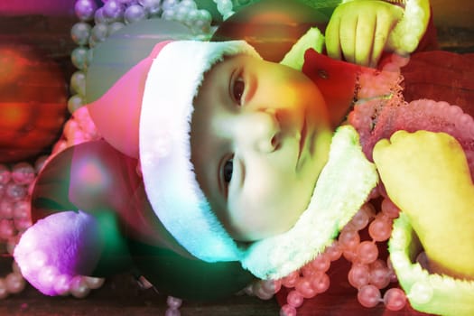 Beautiful six week old baby boy wearing a Christmas suit. Layers property of Photographer
