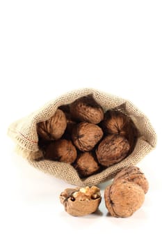 a burlap sack filled with walnuts