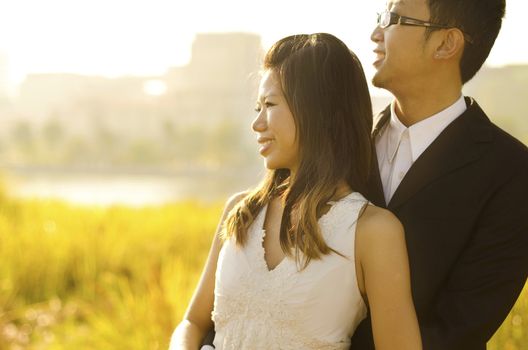 Outdoor Bride and Groom, surrounding by natural morning golden sunlight.