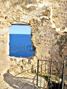 View of the sea from an old stone tower