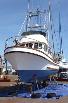 Boat on stands to be serviced and repaired.