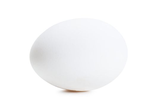 Closeup view of white egg isolated over white background