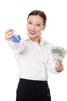 Beautiful businesswoman holding euros bills and keys- real estate loan concept