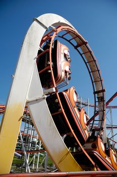 Fast rollercoaster at funfair in a loop