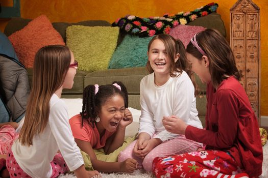 Little Girls at a sleepover laugh together