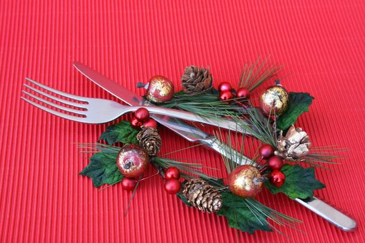 Knife and Fork in a christmas decoration as a table setting
