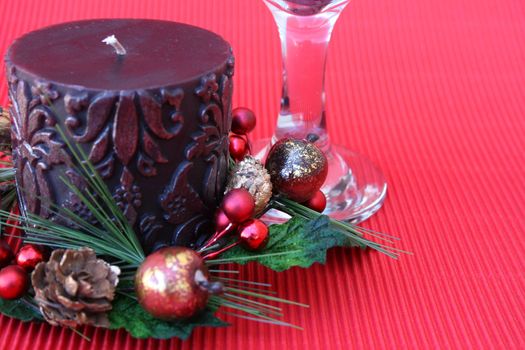 Christmas Table setting with candle and wine glass