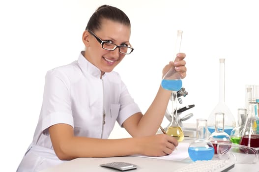 young beautiful woman scientist works in lab