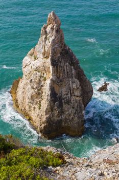 seascape with rock jutting from the ocean, Portugal