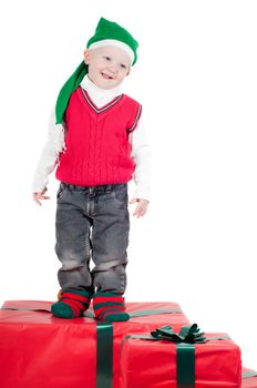 Shot of christmas toddler with presents isolated on white