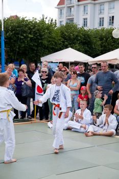 SOPOT, POLAND - JULY 16: The karate kids fighting for the competition on July 16, 2011 in Sopot, Poland
