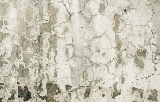 Surface of old plaster on the wall are covered with cracks