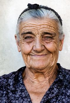 Image shows a happy old lady from a village in Greece