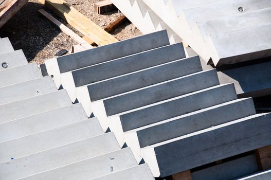 Concrete stairway, wood and iron materials in a construction site