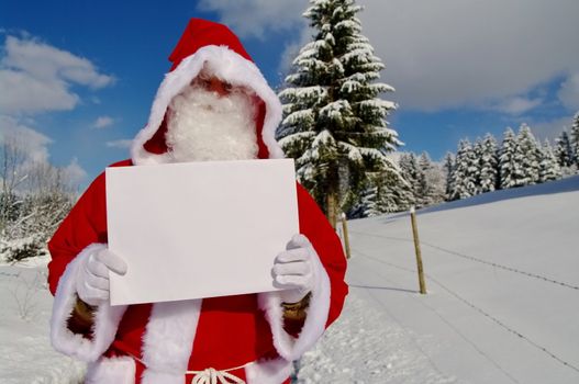 Santa Claus, Father Christmas holding blank sign