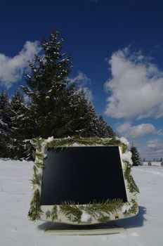 a decorated screen in snowy winter landscape