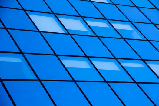 a modern blue glass silhouettes of skyscraper