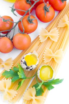Pasta ingredients with cherry tomato, eggs and greens