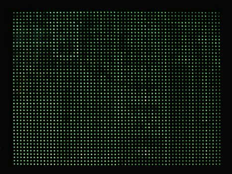 close up of green computer blinking lights