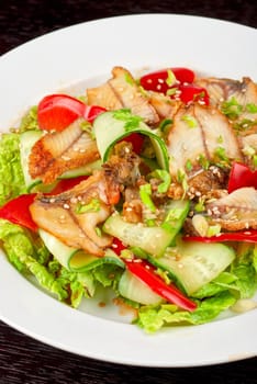 Salad of smoked eel, lettuce,Chinese cabbage and vegetables