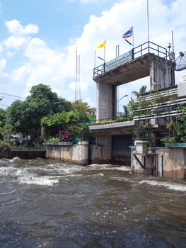 Thawi Watthana floodgate opening to relieve pressure from flooding, Bangkok, Thailand