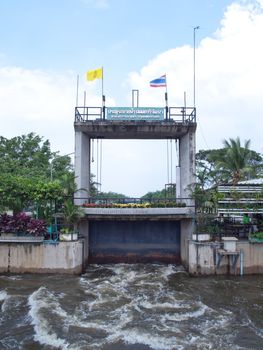 Thawi Watthana floodgate opening to relieve pressure from flooding, Bangkok, Thailand