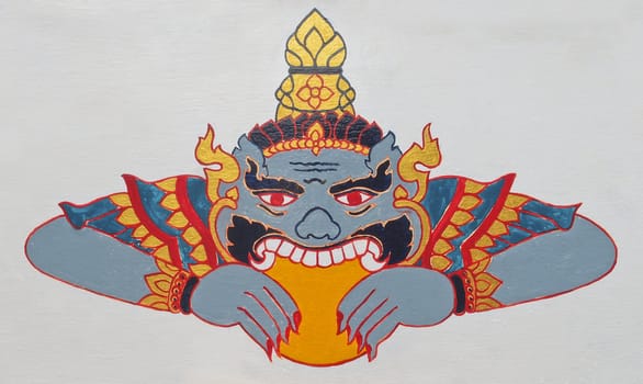 Thai style molding art, giant eating moon or a celestial monster which causes elipses by eating the sun or moon (lunar eclipse) at Thailand temple, Thai culture