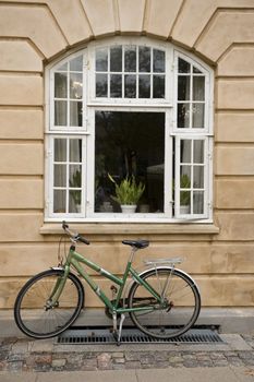 Bicycle near a city building, taken in Copengagen Denmark