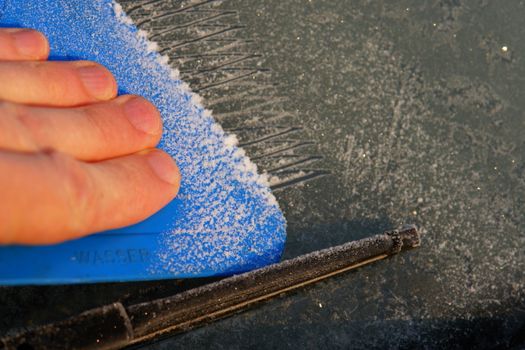 car windshield covered with ice and snow