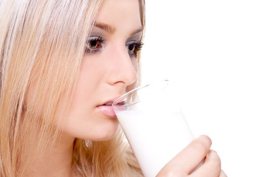 beautiful woman drinking milk on a white background