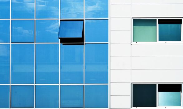 Open window in modern glass wall office building