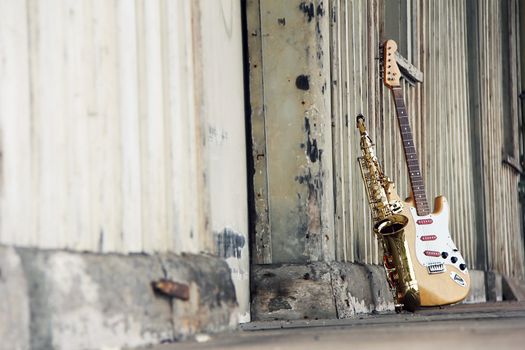 old grungy saxophone with old retro guitar