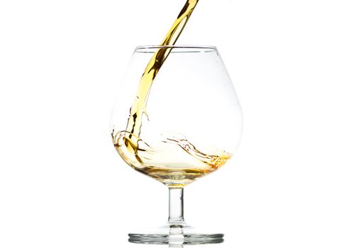filling a glass of brandy, close-up